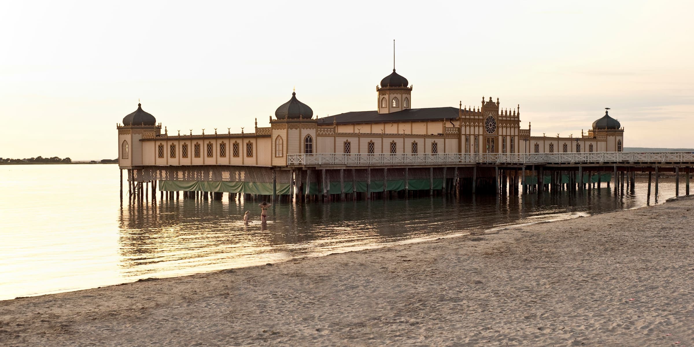 Varberg's Moorish-style cold-bath house on stilts in the sea at sunset