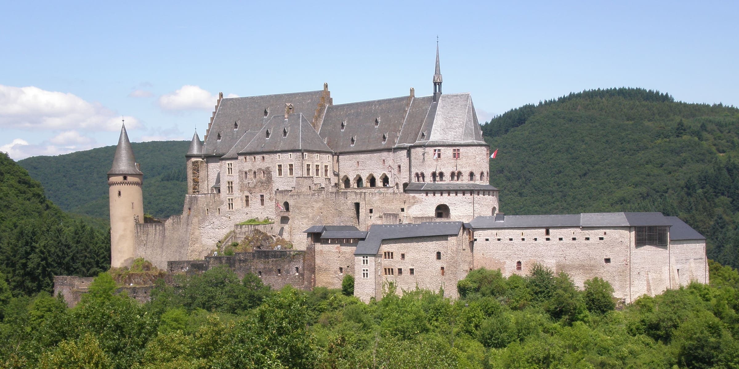 Vianden Castle on its wooded hill above the Our valley