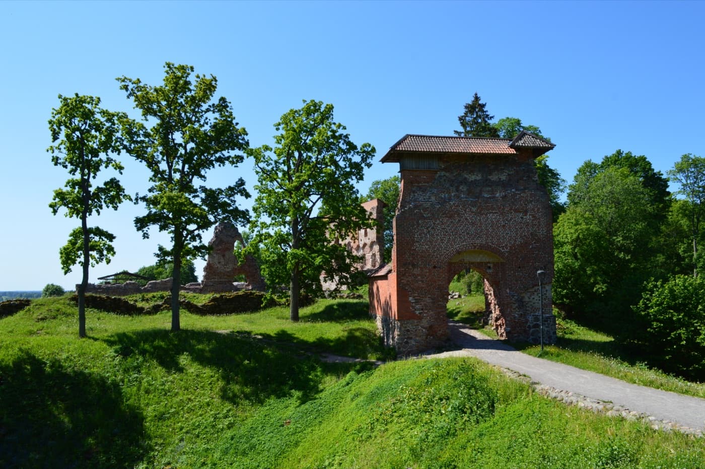 The historic footbridge and massive brick ruins of the Livonian Order Castle on Viljandi Castle Hill