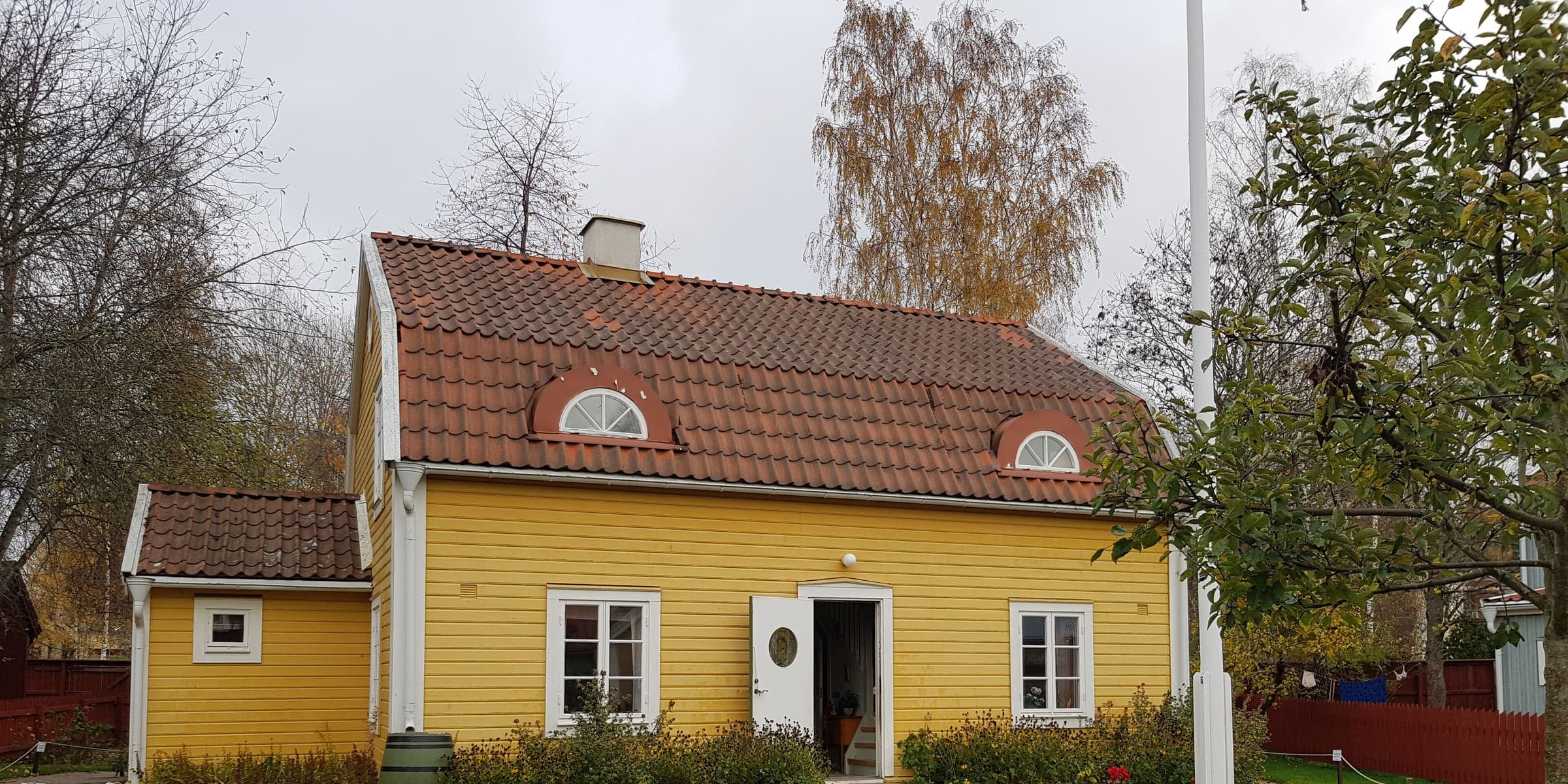 A yellow wooden house from the stories at Astrid Lindgren's World in Vimmerby