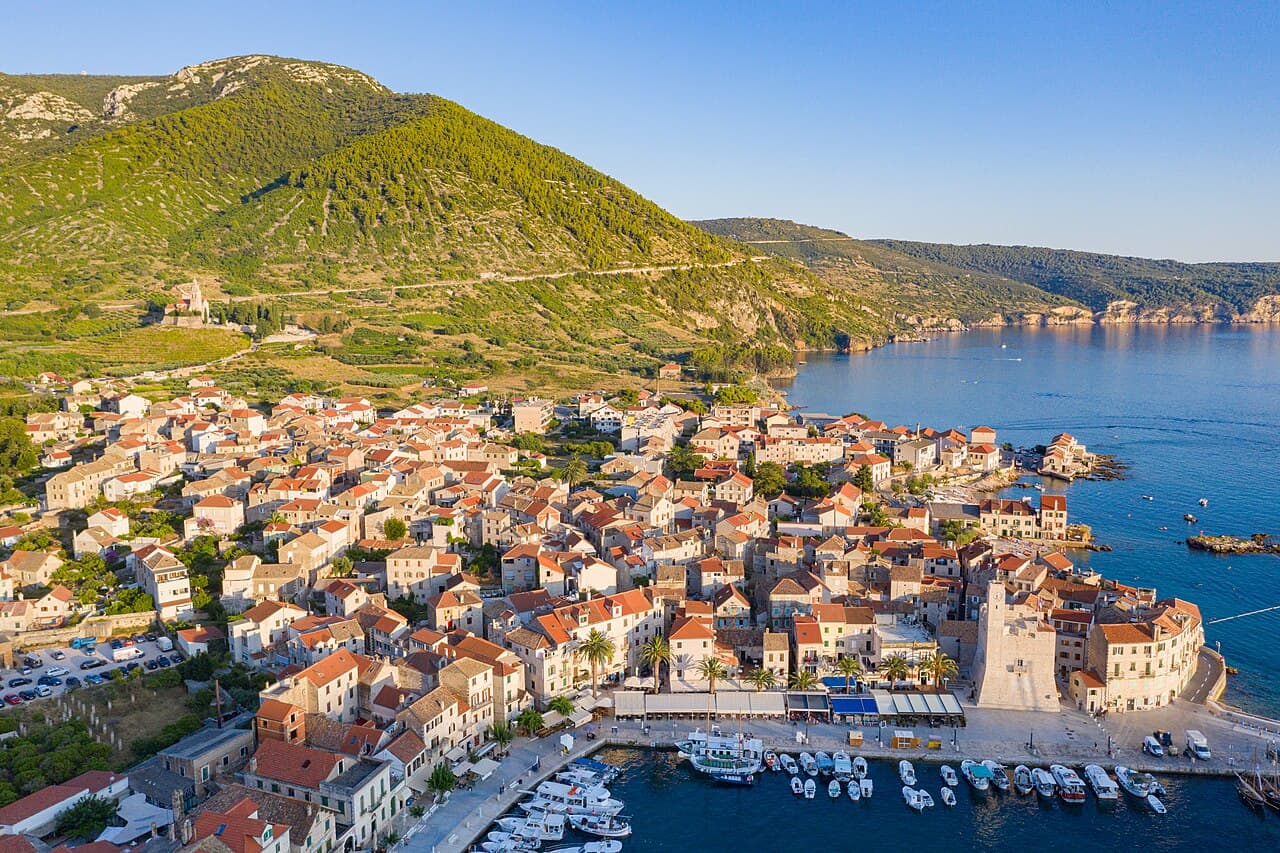 The picturesque fishing harbour and St. Nicholas church of Komiža on Vis island