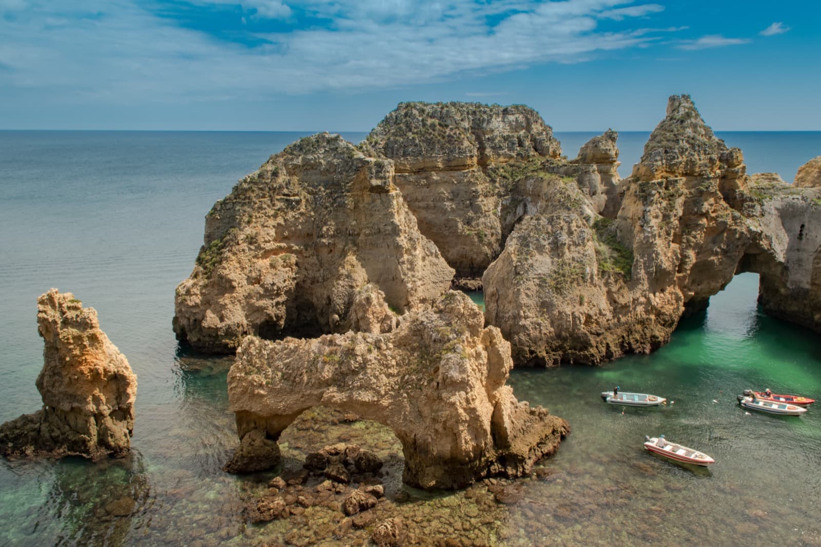 Golden limestone cliffs and sea pillars at Ponta da Piedade in Lagos
