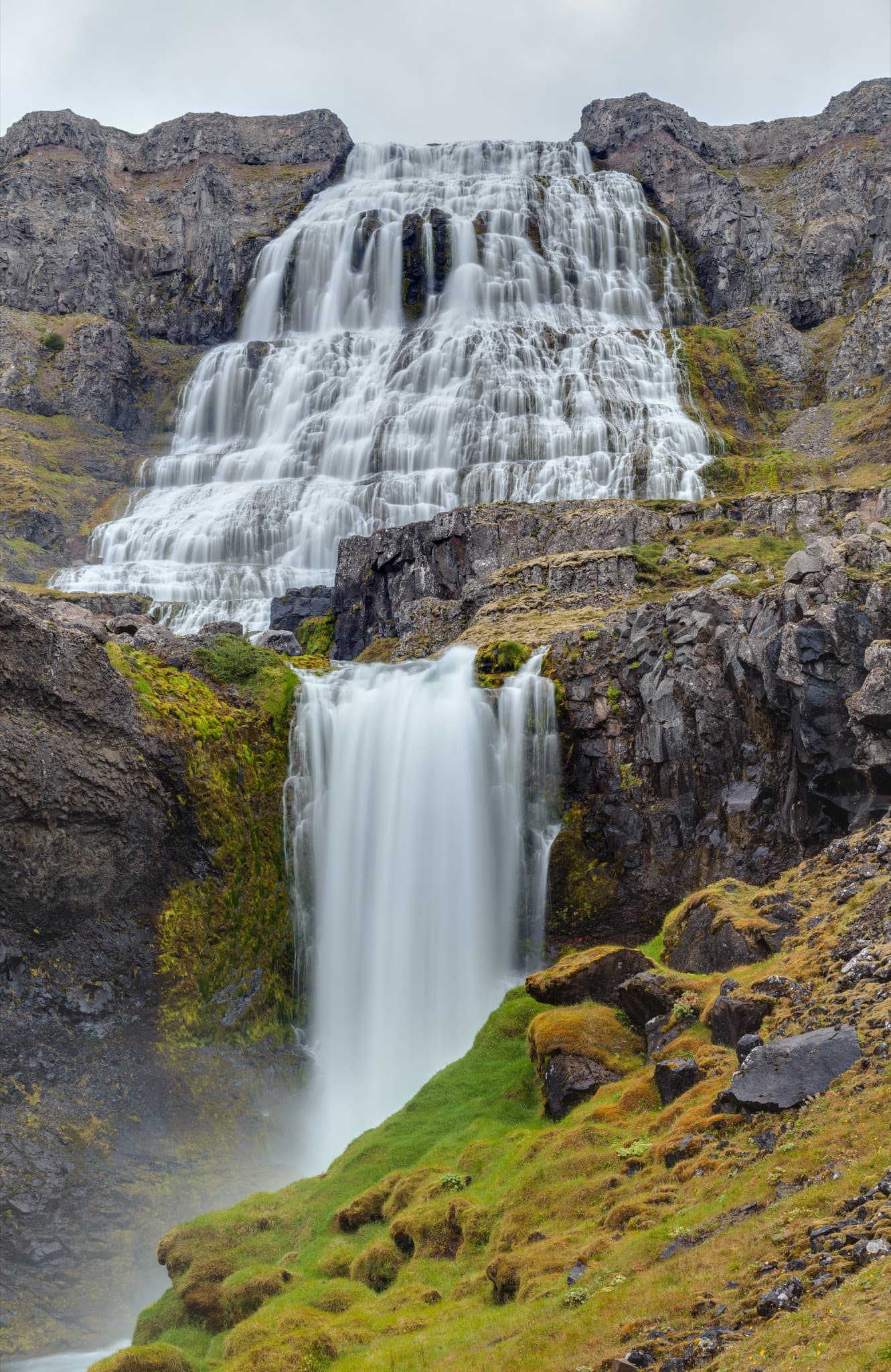 Cascading tiers of Dynjandi waterfall descending into the fjord in the Westfjords