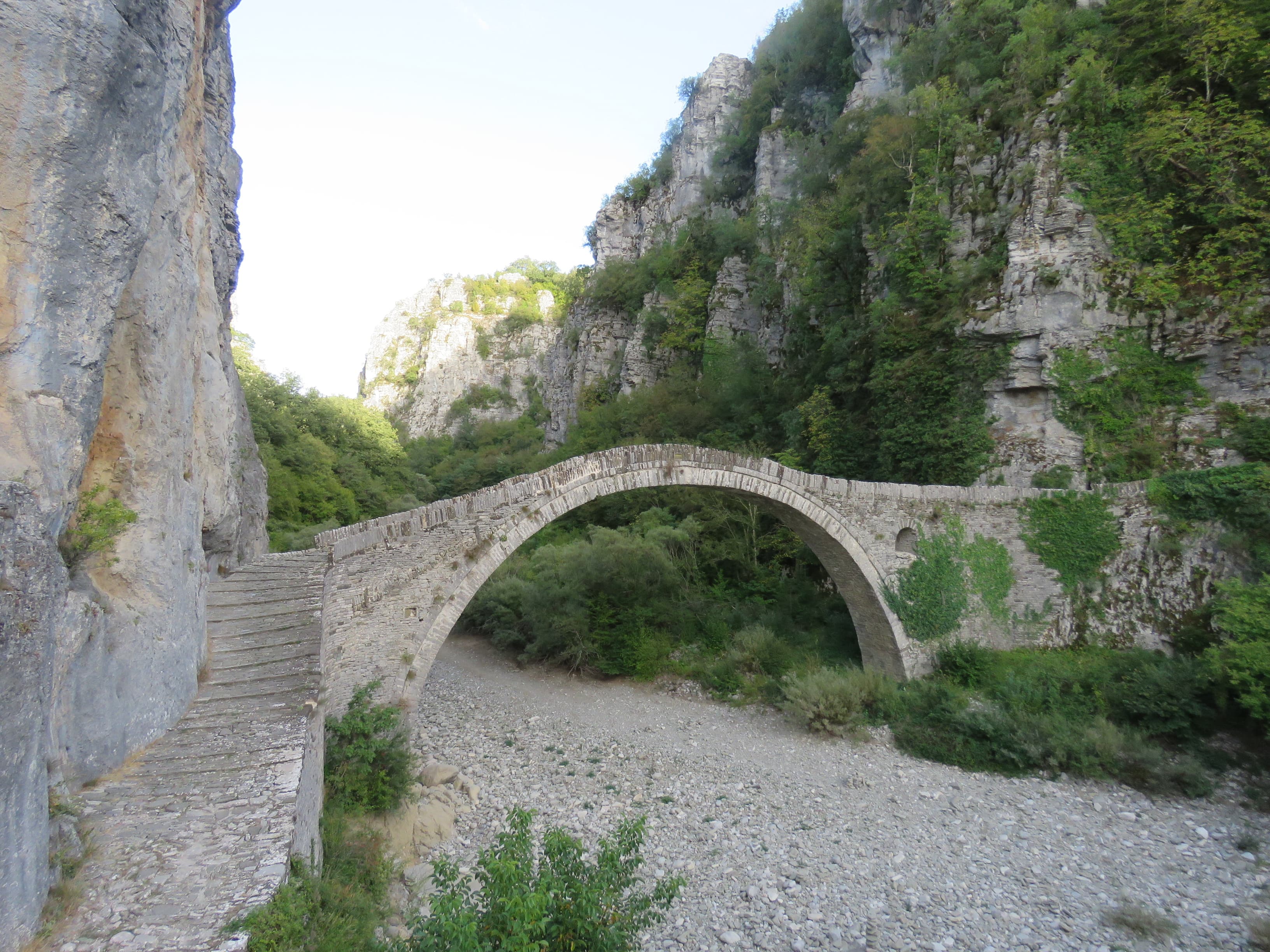 Historic arched stone Kokkoros bridge spanning the gorge in Zagori