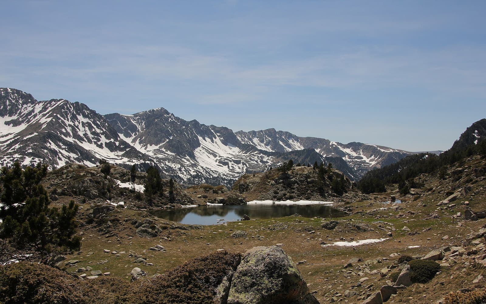 A high lake and snow-streaked peaks in the Madriu-Perafita-Claror valley