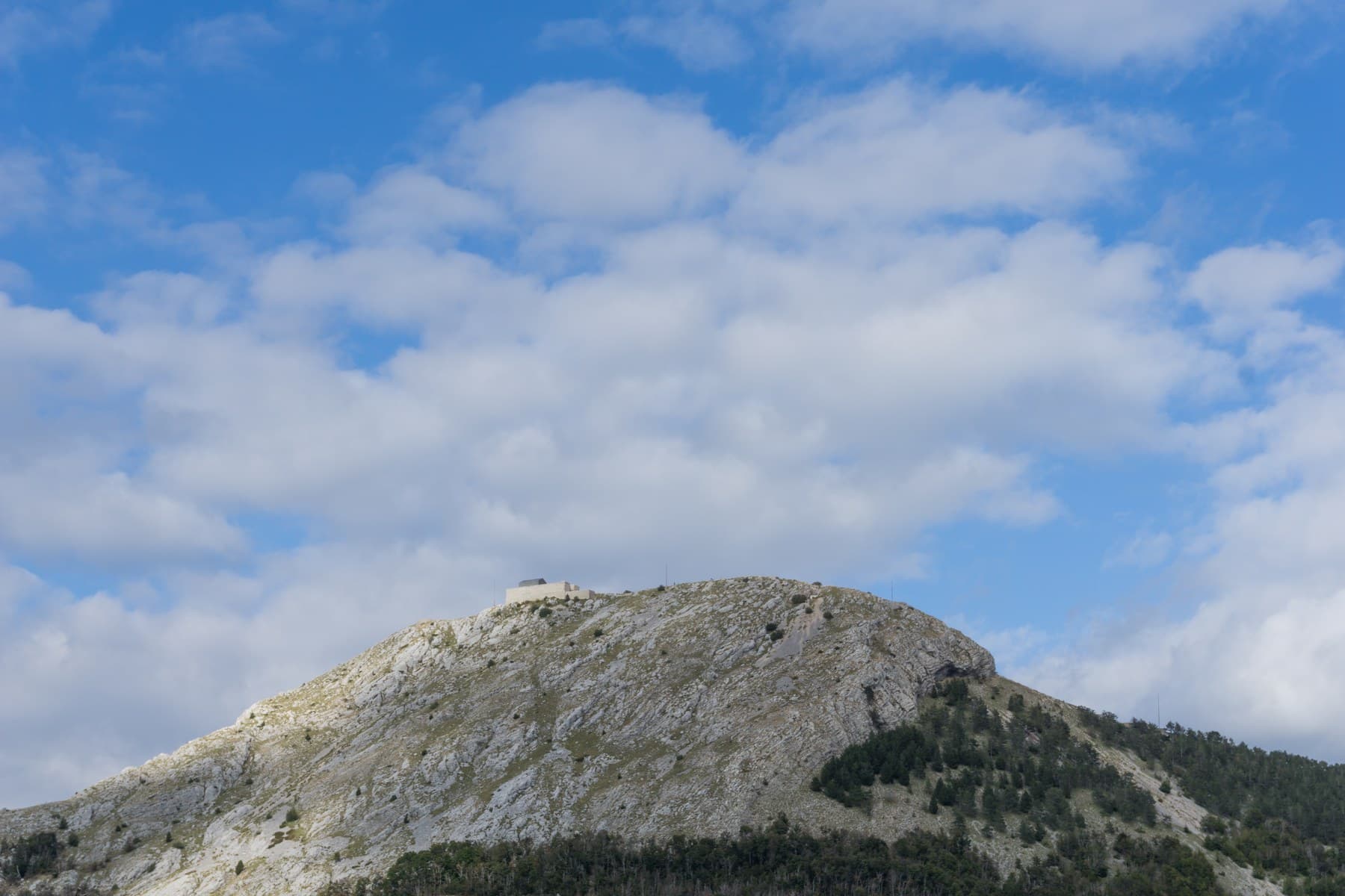 The stone monument of Njegoš Mausoleum perched high upon the rocky summit of Jezerski Vrh on Mount Lovćen
