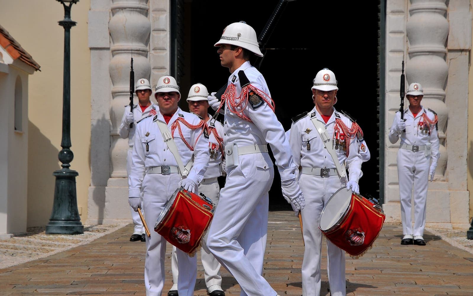 The Prince's Carabiniers in white uniforms with drums outside the palace