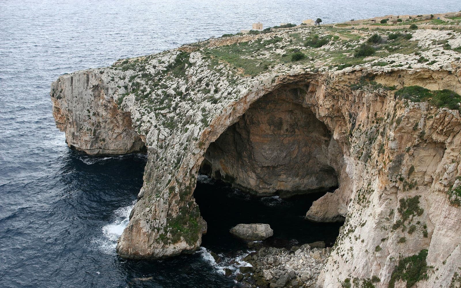 The arch of the Blue Grotto on Malta's southern cliffs