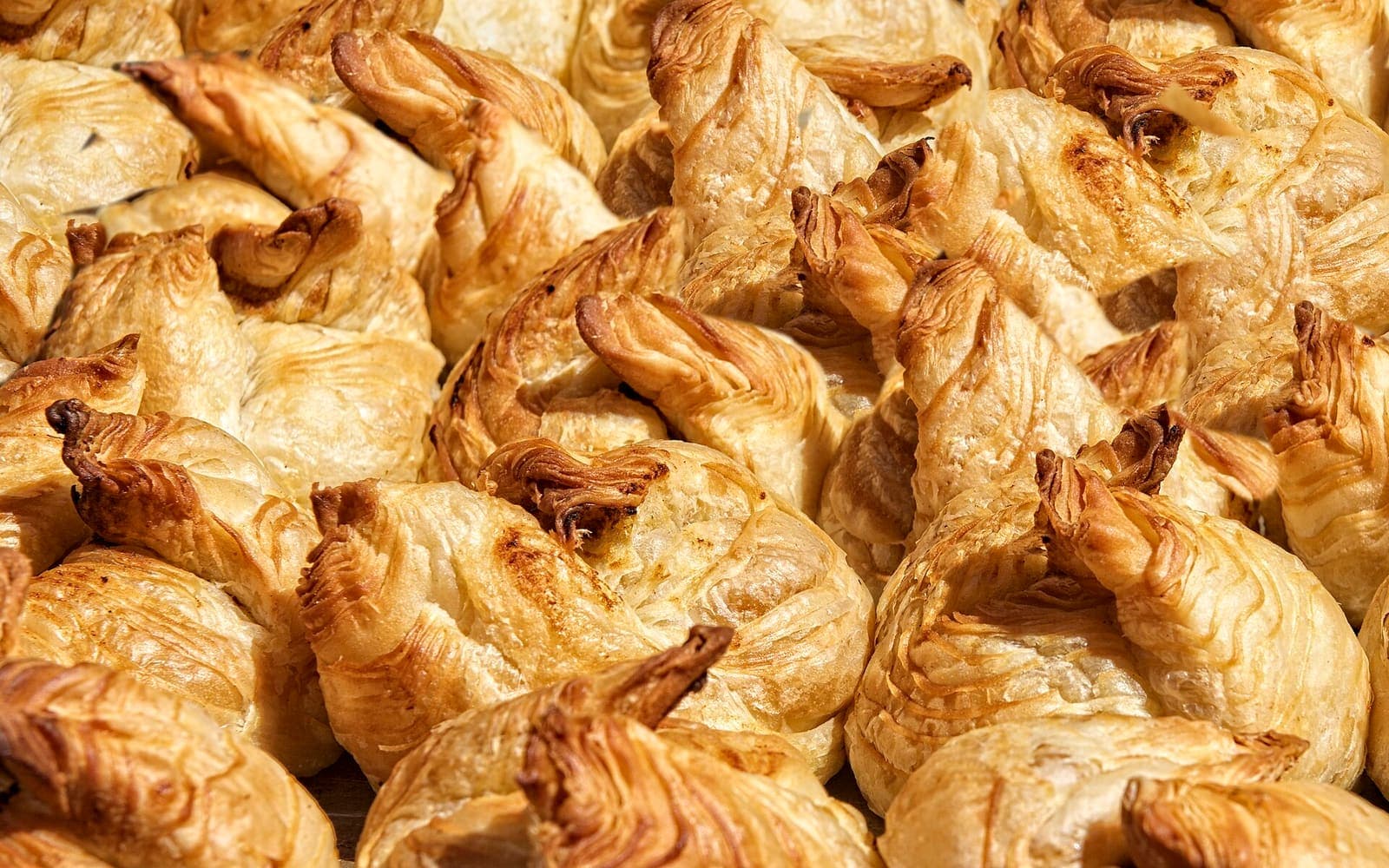 A tray of golden, flaky pastizzi