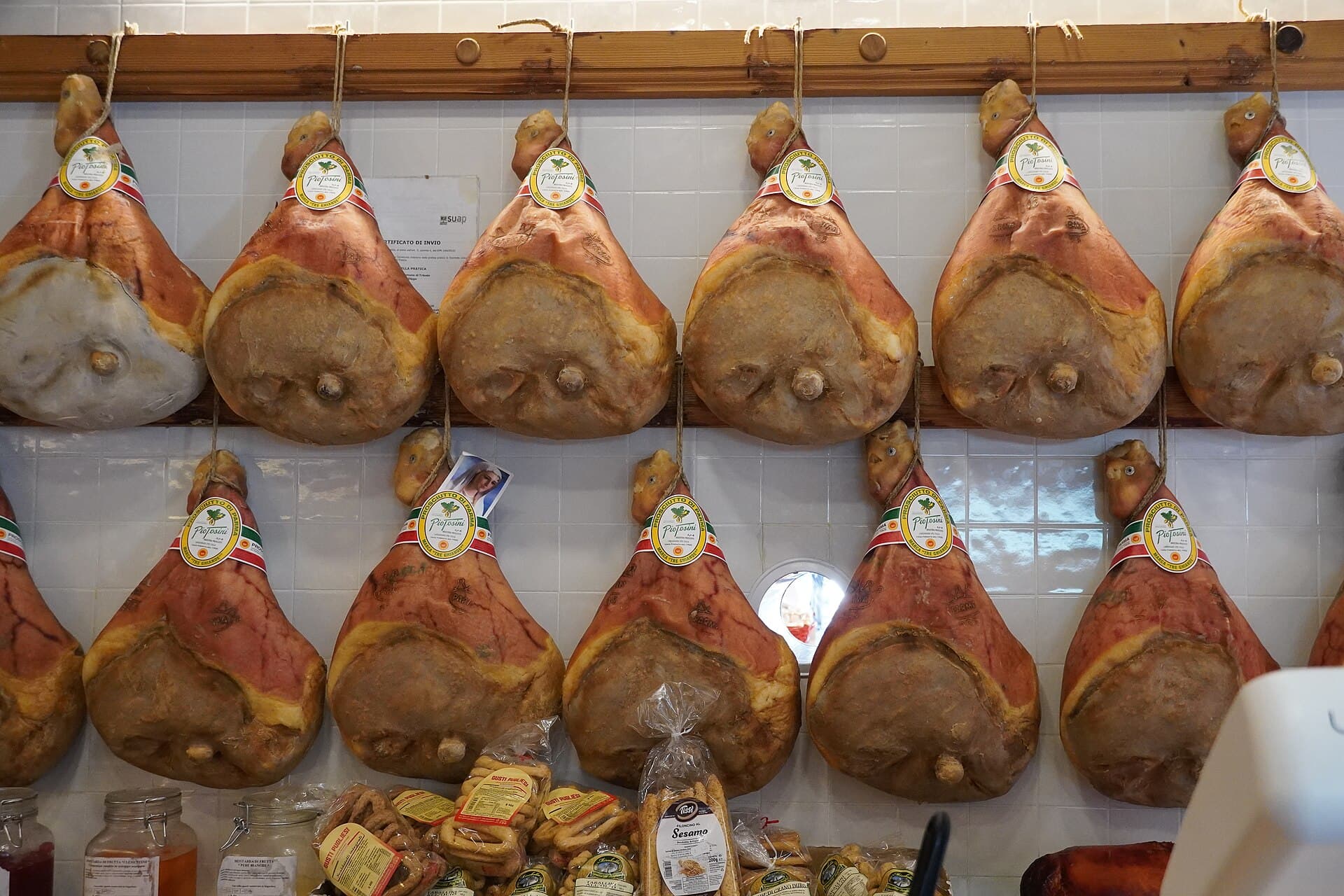 Paper-thin slices of authentic Prosciutto di Parma DOP draped over artisanal bread with Parmigiano Reggiano