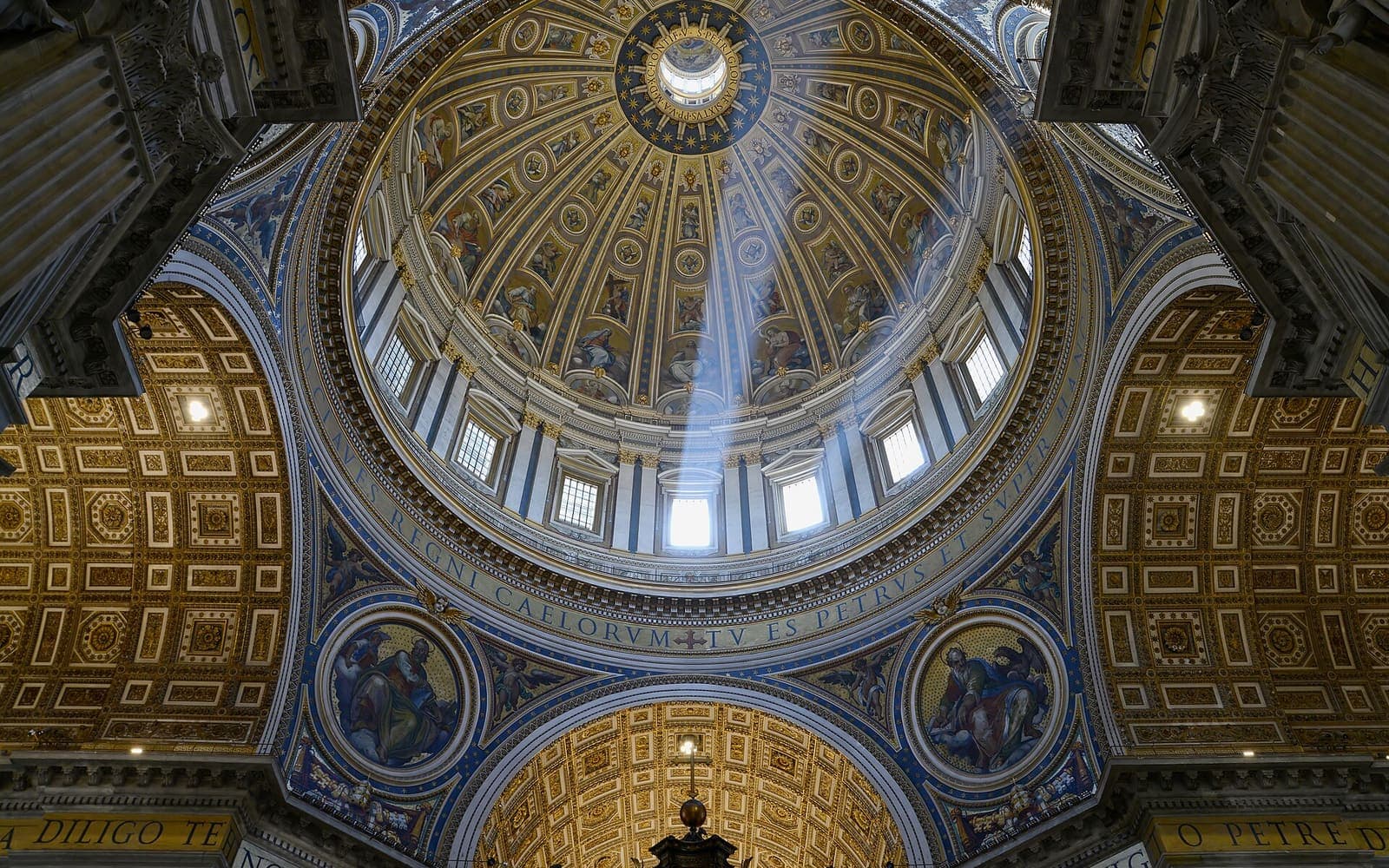 Light falling through the windows of the dome of St Peter's Basilica