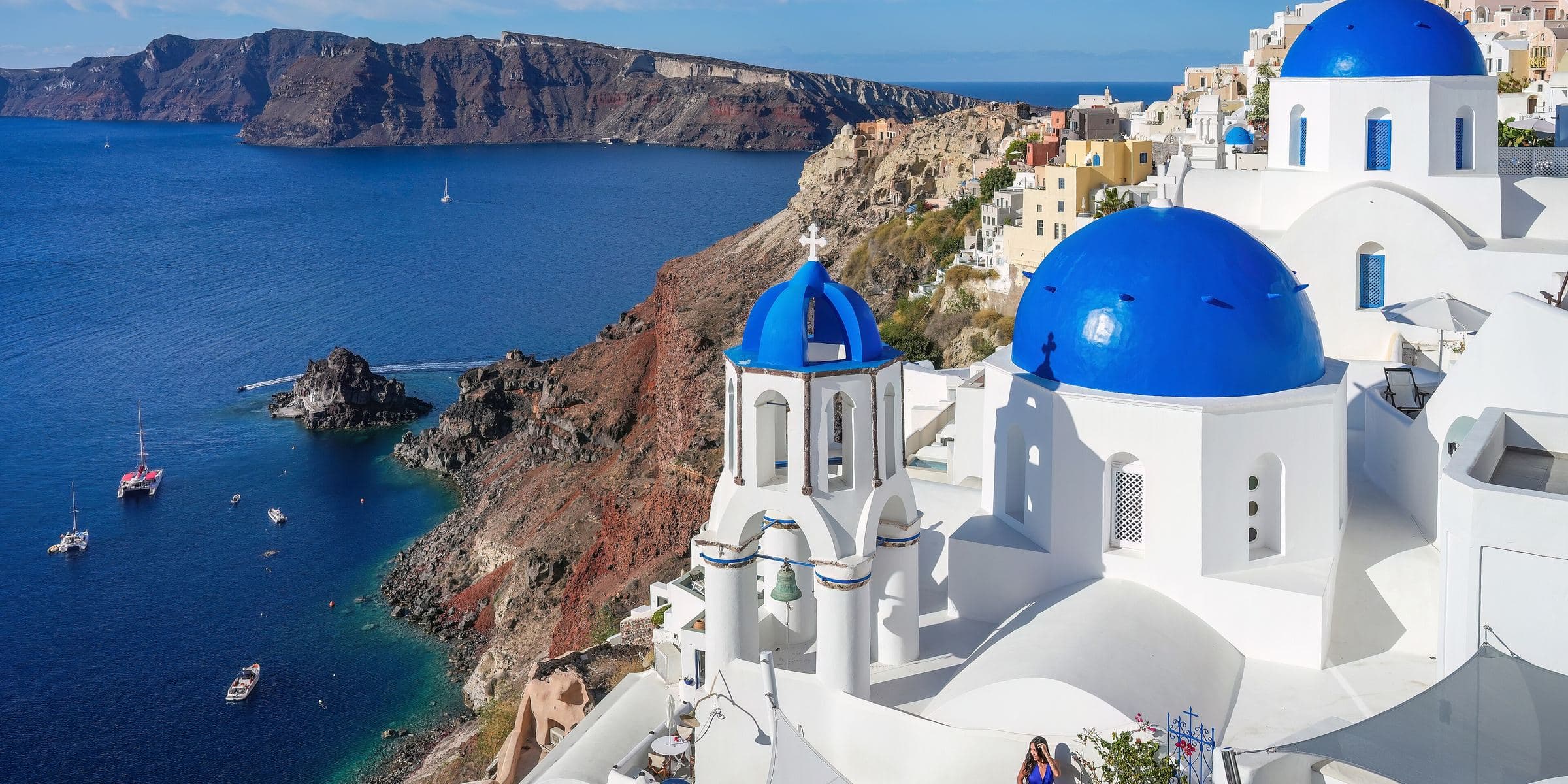 Blue-domed churches above the caldera in Oia, Santorini