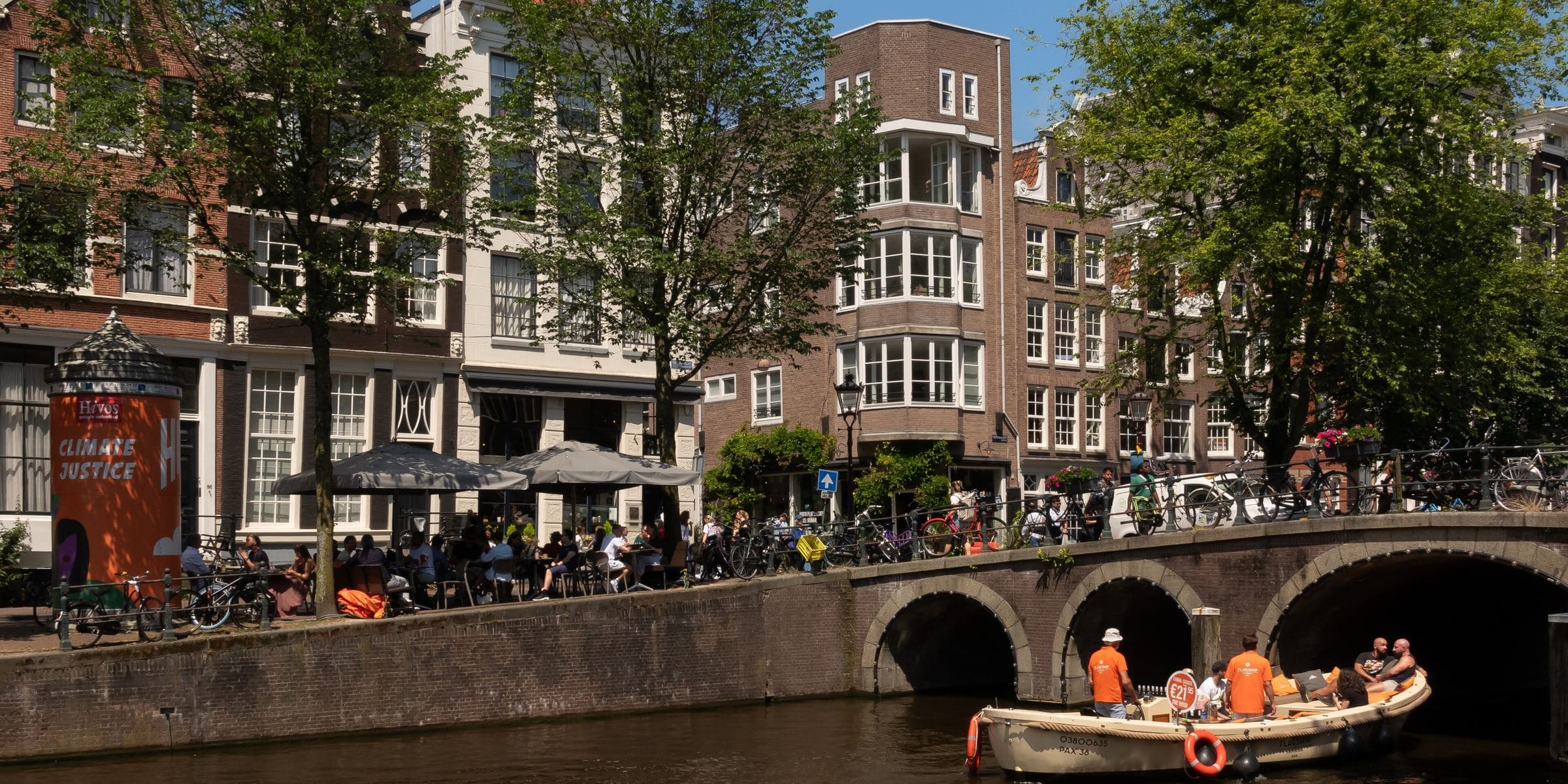 A canal boat under a bridge on the Herengracht in Amsterdam
