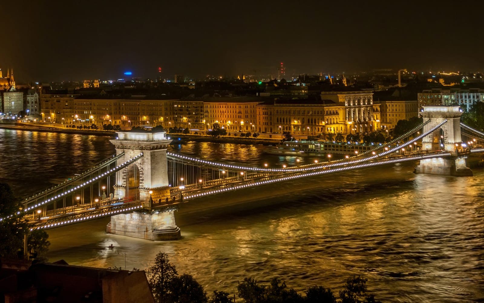 The Széchenyi Chain Bridge lit at night over the Danube in Budapest