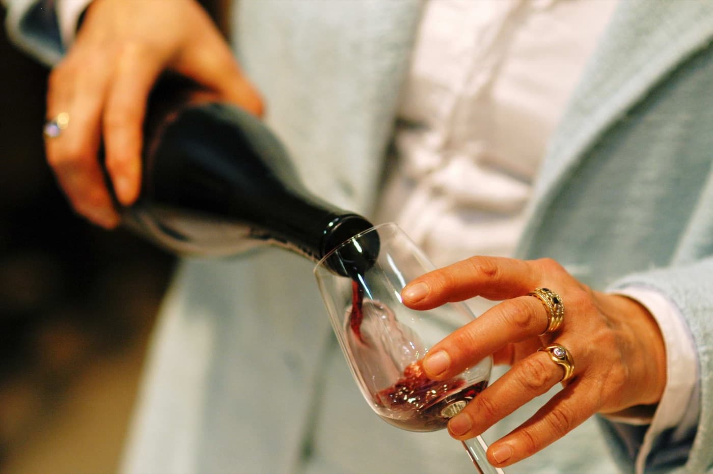Deep dark glass of Broad-leaved Melnik red wine tasting in a natural sandstone cellar