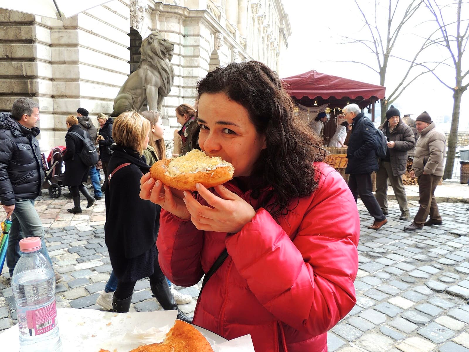 Crisp golden fried lángos flatbread loaded with garlic, sour cream and cheese